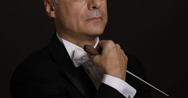 Photo of the conductor on a black background.