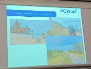 na dużym ekranie w sali wyświetlana jest prezentacja