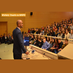 Sala wykładowa, uczestnicy wykładu i prowadzący