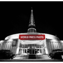 Exhibition poster - picture of the building where the exhibition takes place, the Spire at Poznań International Fair