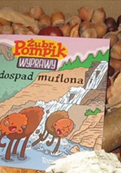 Książka położona na kasztanach, żołędziach, lisciach i szyszkach.