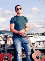 Baner promujący wydarzenie. Nazwa wydarzenia i zdjęcie artysty.