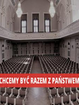 Zdjęcie widowni auli i napis "chcemy być racem z Państwem".