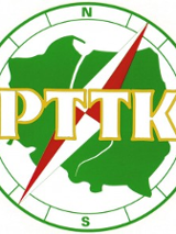 Logo PTTK- zielony kształt Polski na kompasie.