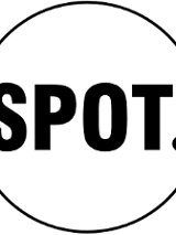 Obrazek to logo fundacji spot. Składa się ono z napisu spot wykonanego prostymi, wielkimi literami z kropką po ostatniej literze. Napis jest wpisany w okrąg, a całe logo utrzymane jest w czerni i bieli.