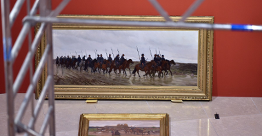 Zdjęcie przedstawia obraz przedstawiający żołnierzy na koniach.