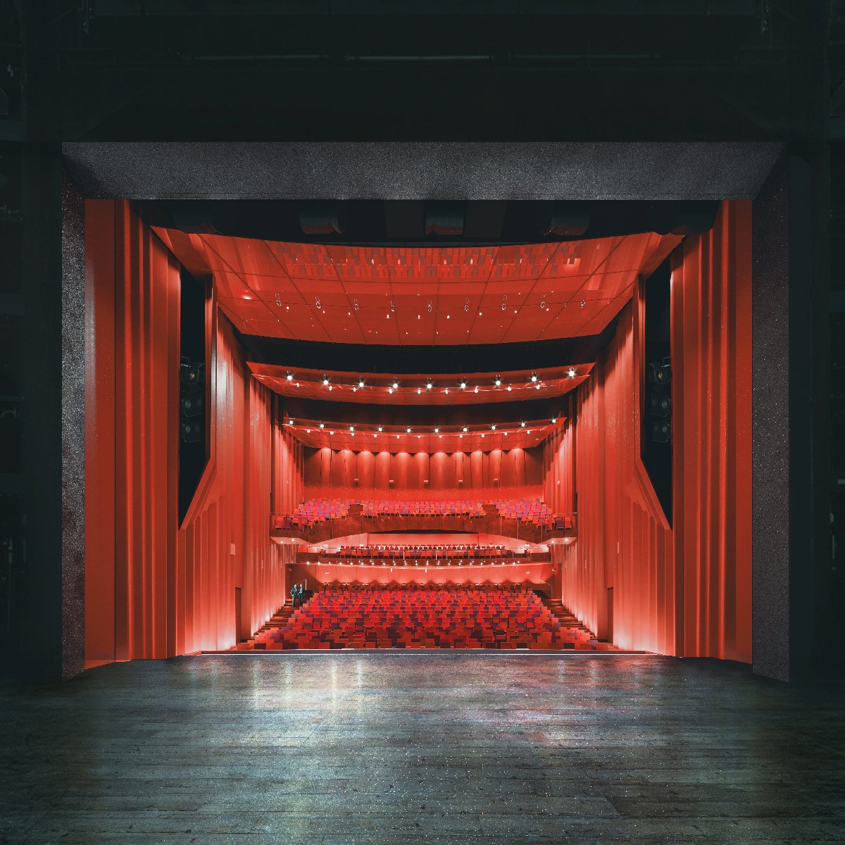 Wizualizacja: widok na widownię teatru, na pierwszym planie scena, w tle czerwone krzesła i kotary na widowni - grafika artykułu