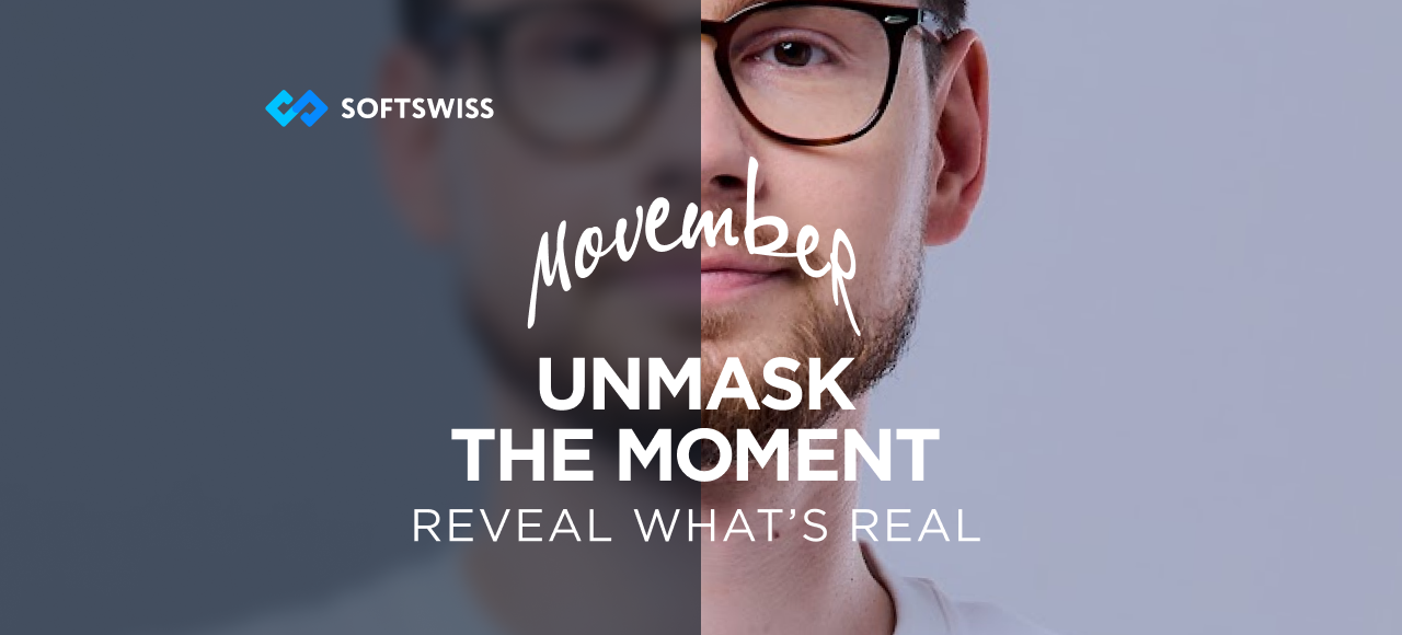 Mężczyzna w okularach z wąsami. Napis w języku angielskim: Movember. Unmask the moment. Reveal what's real.