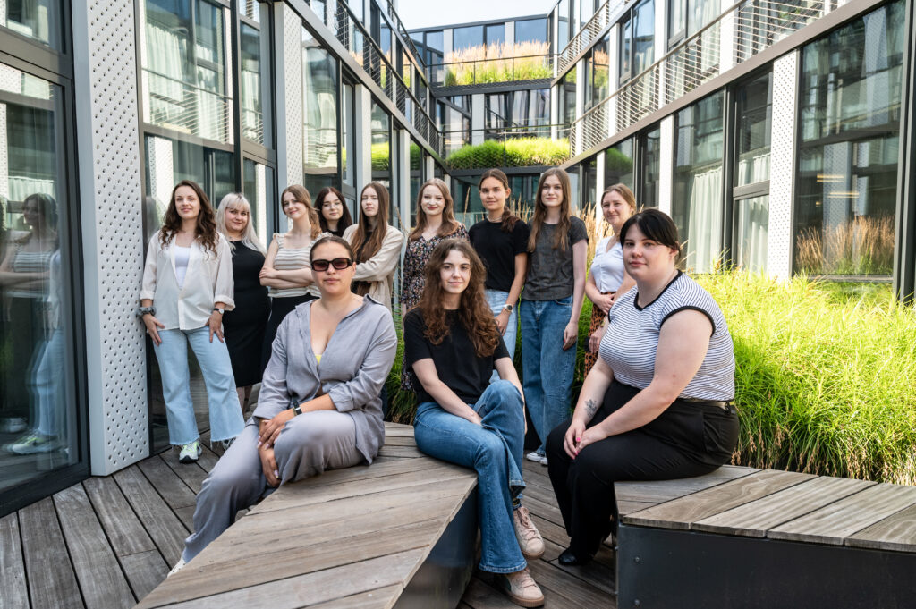 Participants of the previous edition of the Success University sitting on the terrace of the City Hall building in Za Bramką Street