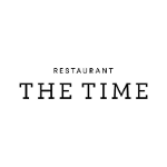 Napis Restaurant The Time w kolorze czarnym na białym tle.