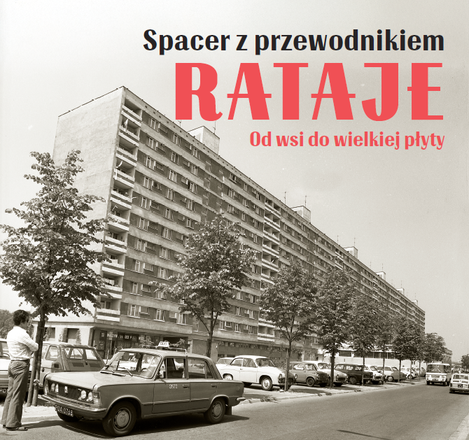 Czarno-białe zdjęcie przedstawiające dziesięciopiętrowy blok, tzw. deskę. Przed budynkiem zaparkowane są auta. Zdjęcie wykonano w czasach PRL-u.