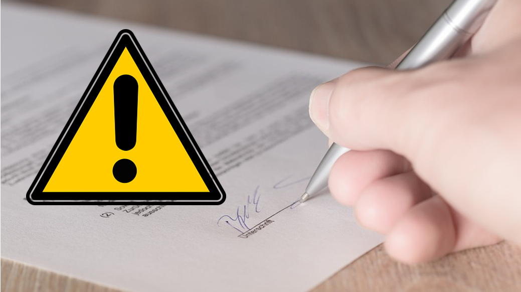Ilustracja przedstawia dłoń podpisującą umowę oraz trójkątny znak ostrzegtawczy z wykrzyknikiem.