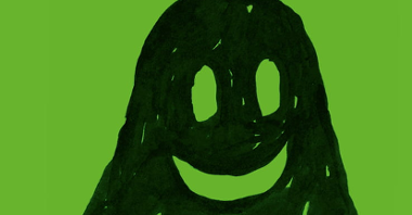 Okładka książki. Narysowany prostą kreską (dziecięcą?) obrazek uśmiechniętego ducha na zielonym tle