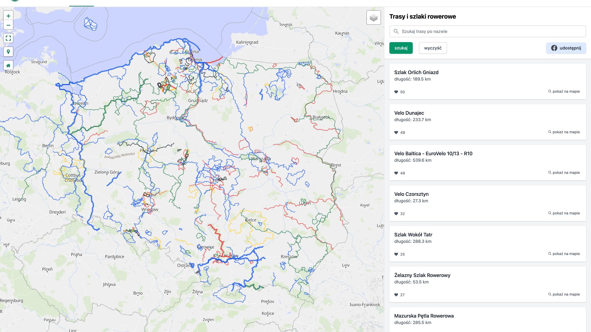 Obrazek przedstawia zrzut ekranu z portalu Velomapa, czyli rowerowej mapy społecznościowej. Widoczna jest na nim mapa Polski, z zaznaczonymi trasami i szlakami rowerowymi, przedstawionymi jako linie w różnych kolorach.
