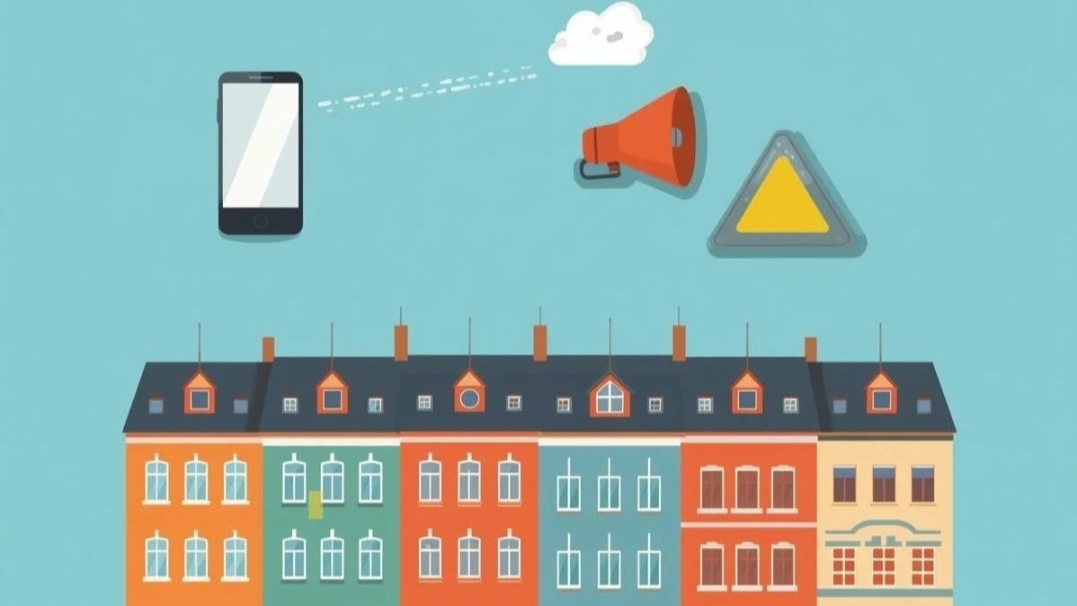 Grafika, kolorowe kamieniczki a nad nimi telefon komórkowy, żółty trójkąt oraz pomarańczowy megafon.