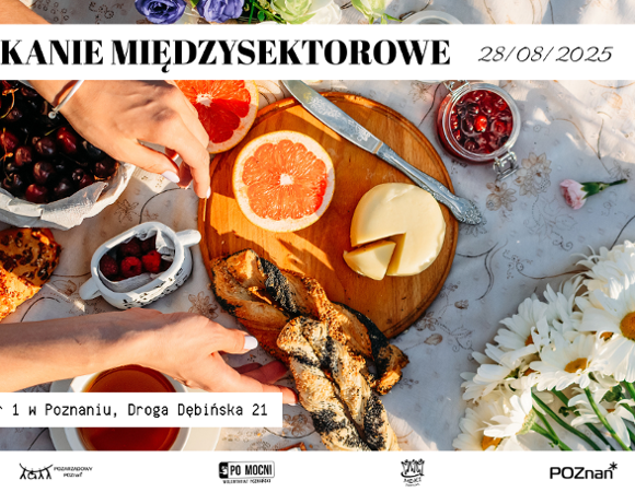 Spotkanie sieciujące w MDK już 28 sierpnia Zdjęcie poczęstunku w formie pikniku, na rozłożonym obrusie owoce, pieczywo, filiżanka herbaty i bukiet kwiatów i sięgajace po jedzenie dłonie