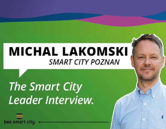 Man looking straight ahead on a green background.