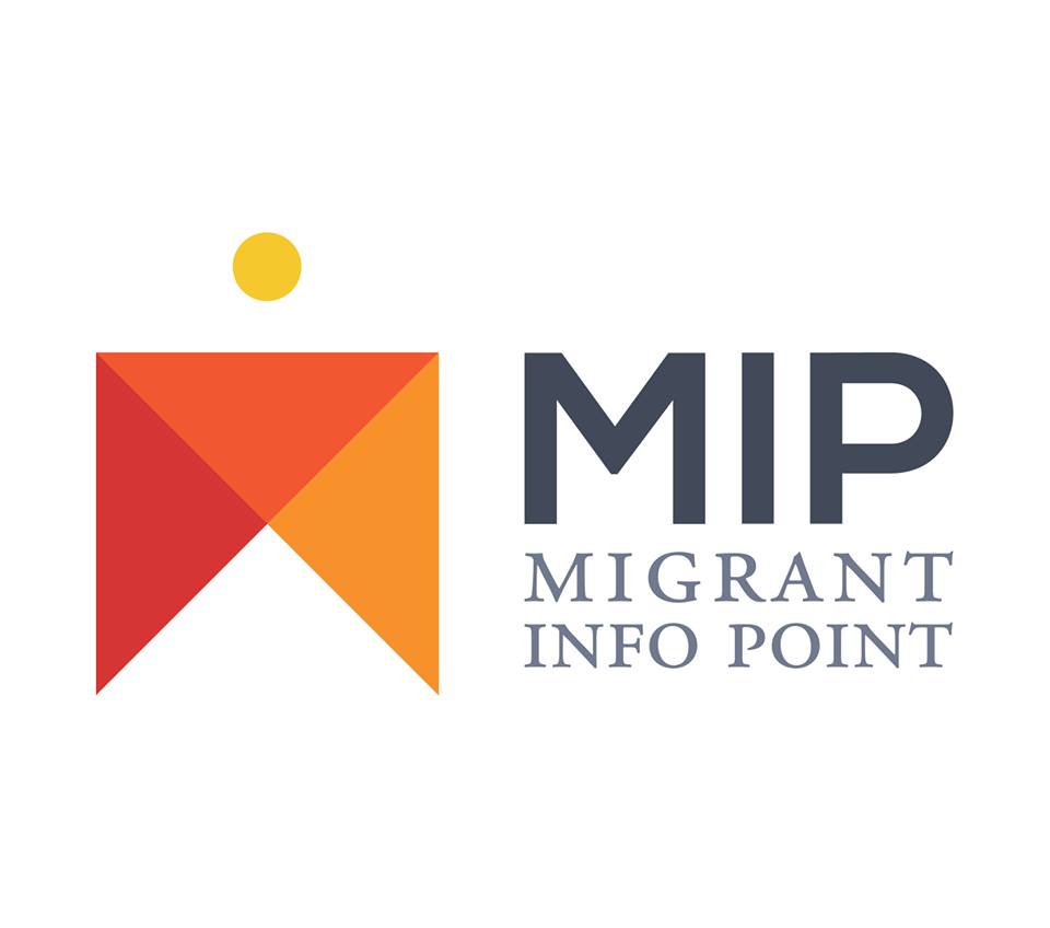 The Migrant Info Point symbol. Red and orange triangles, yellow circle.