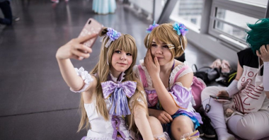 Two girls in disguise taking a selfie.