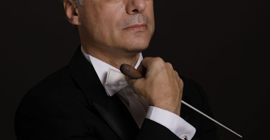 Photo of the conductor on a black background.