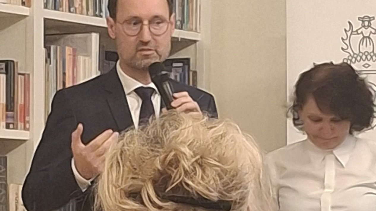 The photo shows a woman and a man
