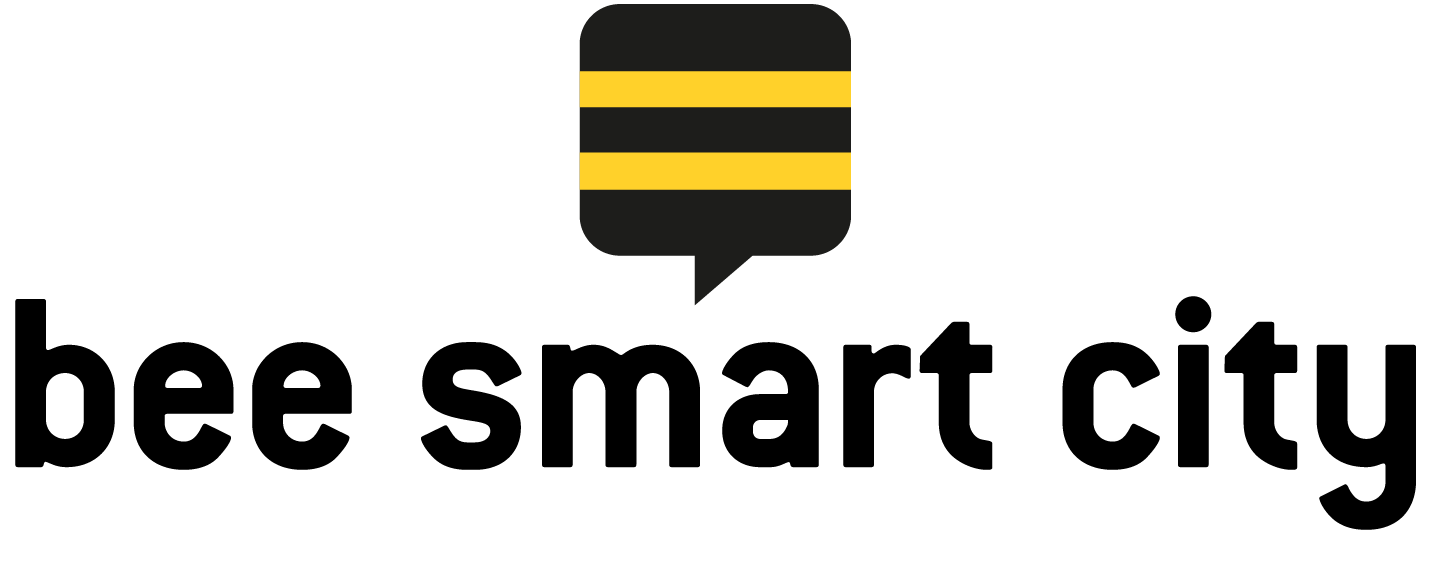 Logo firny bee smart city - czarne litery i czarno żółte paski.