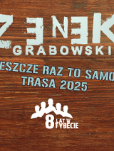 Informacje o koncercie Zenka Grabowskiego, w tle drewniany blat stołu.