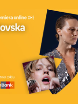 Plakat ze zdjęciem piosenkarki i okładką płyty w prawej części. W części lewej u góry białe napisy na pomarańczowym tle.